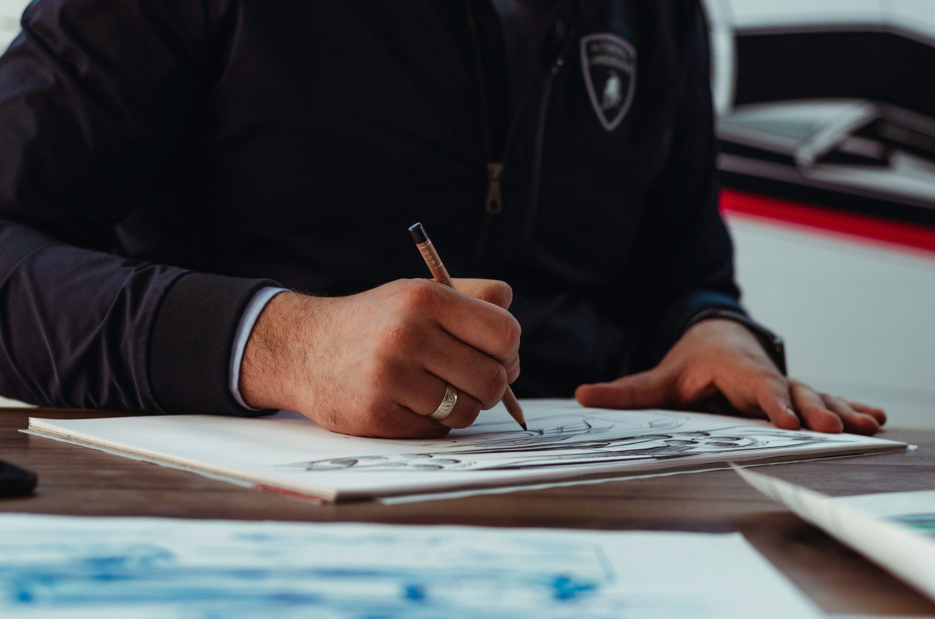 man writing on paper